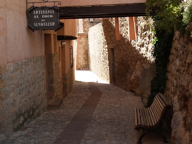 Narrow medieval lane lined with traditional buildings in Albarracín Spain