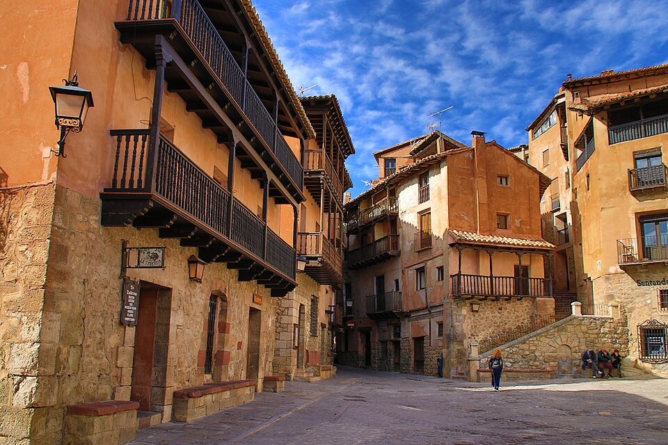 Medieval street lined with traditional buildings in Albarracín Spain