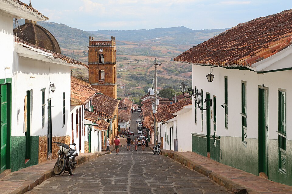Cobblestone street lined with whitewashed buildings in Barichara Colombia