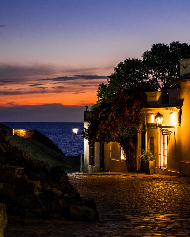 Golden hour light washing over a colonial street in Colonia del Sacramento, Uruguay