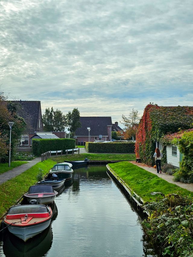 Canal lined with traditional houses in Giethoorn Netherlands