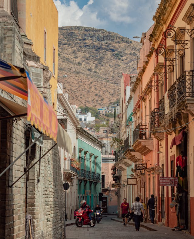Historic street lined with colorful buildings in Guanajuato Mexico