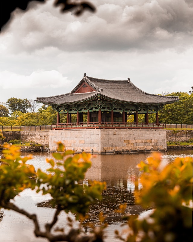 Traditional pavilion reflected in the waters of Wolji Pond