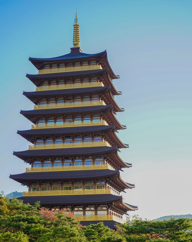 Multi-story Korean pagoda rising above trees