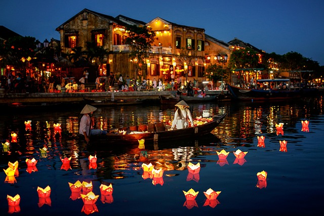 Boats and floating lanterns on the Thu Bon River in Hoi An Vietnam