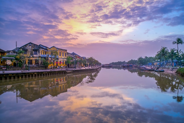 Hoi An, Vietnam riverside with historic buildings at sunset