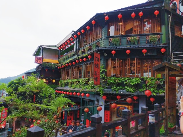 Hillside view of Jiufen village surrounded by green mountains in Taiwan