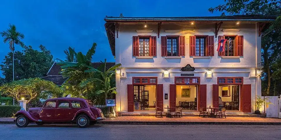 Vintage Citroen parked outside the 3 Nagas Hotel in Luang Prabang