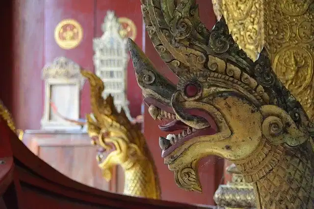 Ornate naga carving decorating a Buddhist temple in Luang Prabang