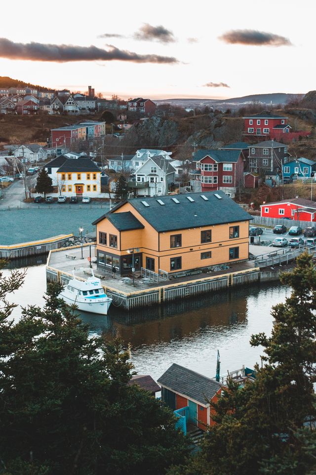 Harbourfront building and colorful hillside homes in Lunenburg Nova Scotia Canada