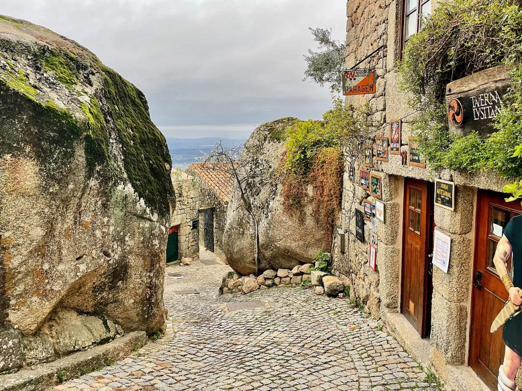 Traditional houses built between giant granite boulders in Monsanto Portugal