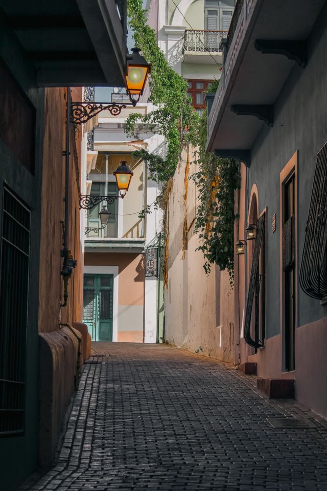Colonial alleyway illuminated by traditional lanterns
