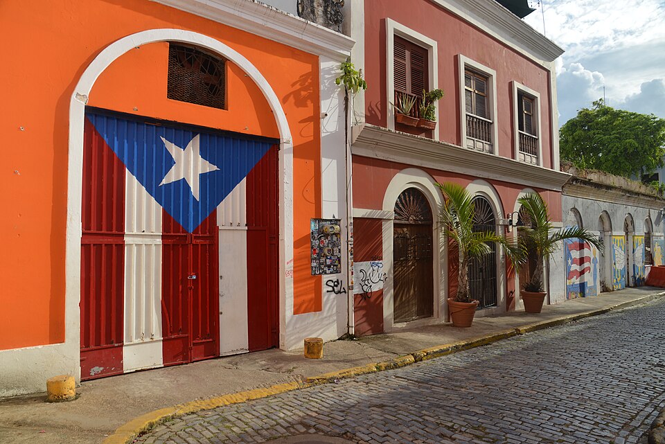 Puerto Rican flag painted on a historic doorway in Old San Juan