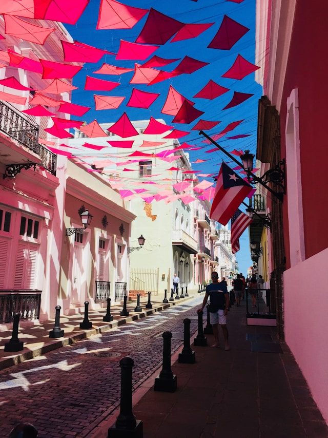 Colorful umbrella installation above a historic street