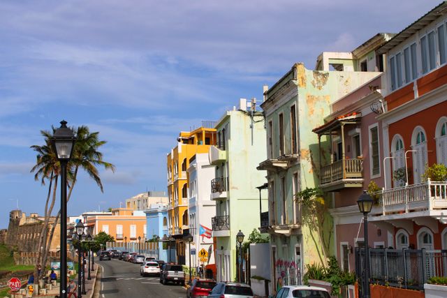 Historic waterfront street lined with colorful buildings in Old San Juan
