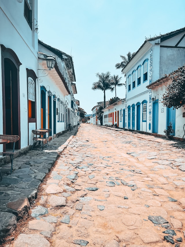 Whitewashed colonial buildings along a cobblestone street in Paraty Brazil