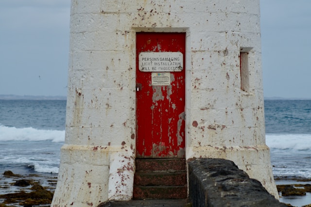 Close-up of the Griffiths Island Lighthouse red door facing the South Pacific