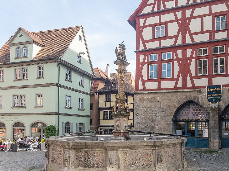The Georgsbrunnen fountain with its ornate column in Rothenburg ob der Tauber
