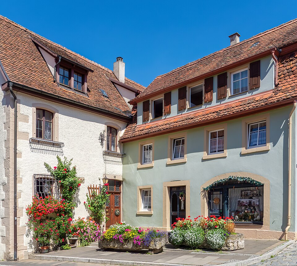 Flower-filled stone troughs beside houses on Klingengasse in Rothenburg ob der Tauber