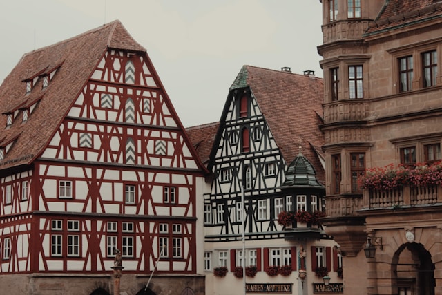 Ornate half-timbered gable houses beside the Town Hall on the Marktplatz in Rothenburg ob der Tauber