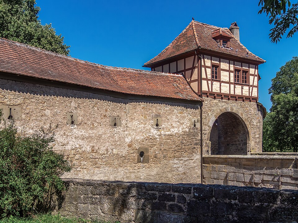 The Rödertor gate with its half-timbered tower rising above the town wall in Rothenburg