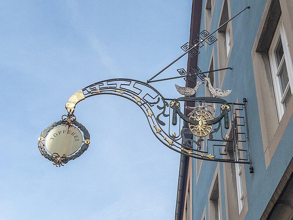 Wrought-iron pottery shop sign reading Töpferei with geese in Rothenburg ob der Tauber