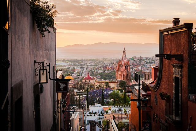 Church spires rising above San Miguel de Allende at dusk