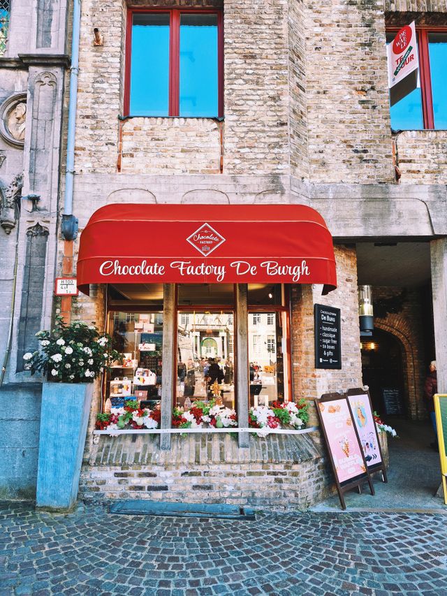 Chocolate Factory De Burgh shop entrance with a red awning