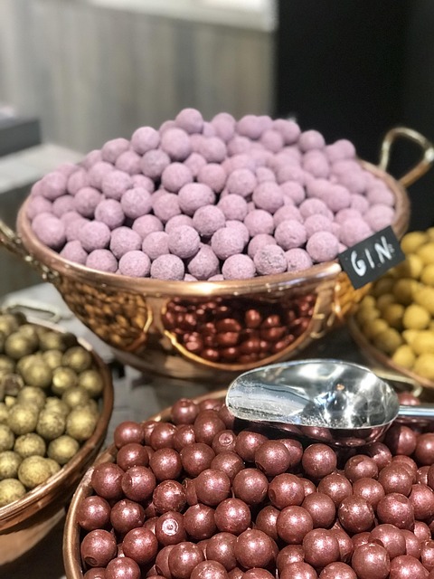 Bowls of colorful Belgian chocolate pralines including gin flavored ones