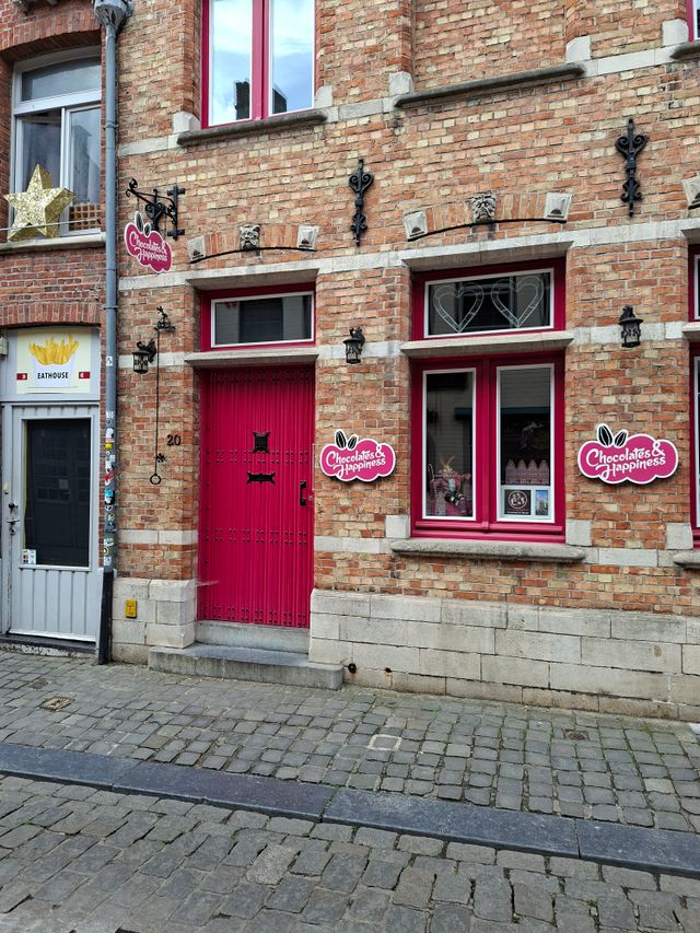 Chocolates and Happiness shop entrance with a red door