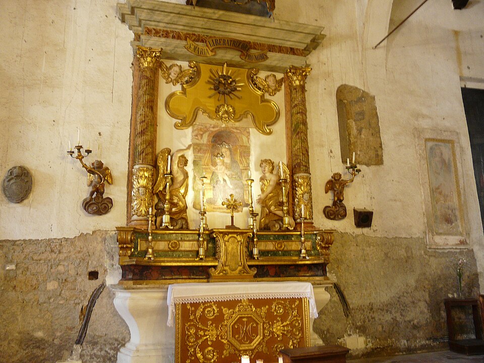 A gilded side altar inside the Church of San Donato