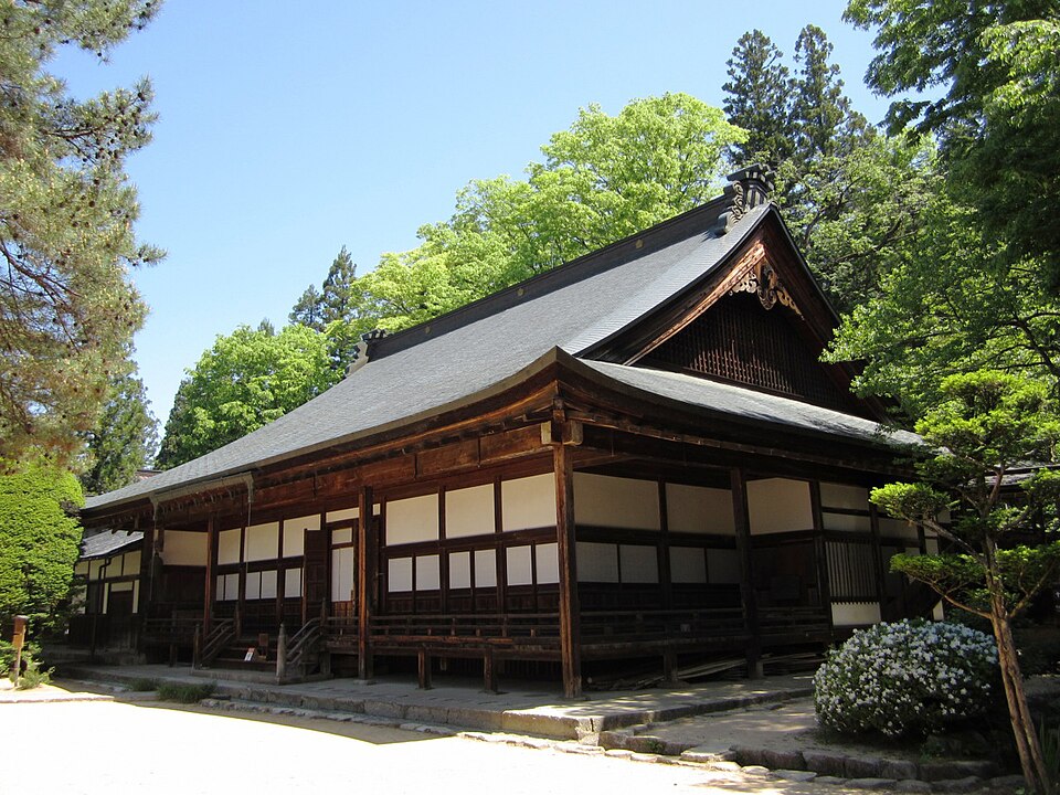 Main hall of Hokke-ji temple in Takayama under a blue sky