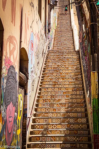 A long staircase covered in ornate patterned ceramic tiles
