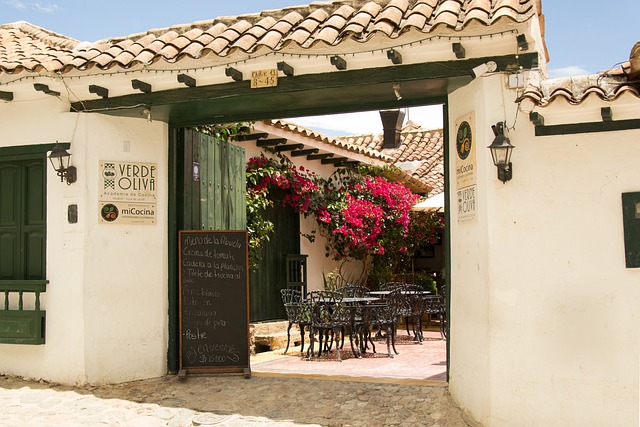 Restaurant entrance draped in bougainvillea at Verde Oliva in Villa de Leyva Colombia
