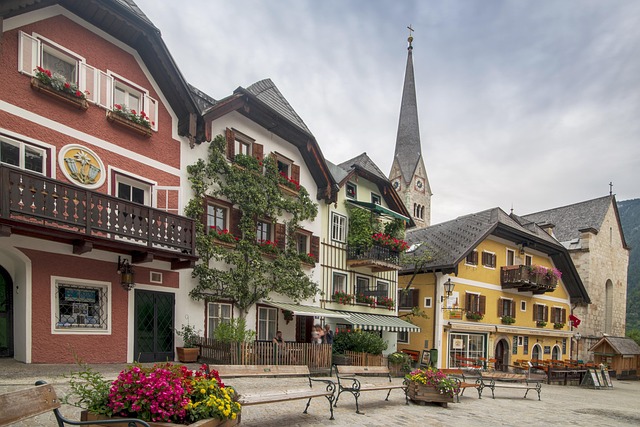 Colorful red, white, and yellow facades lining Hallstatt's market square