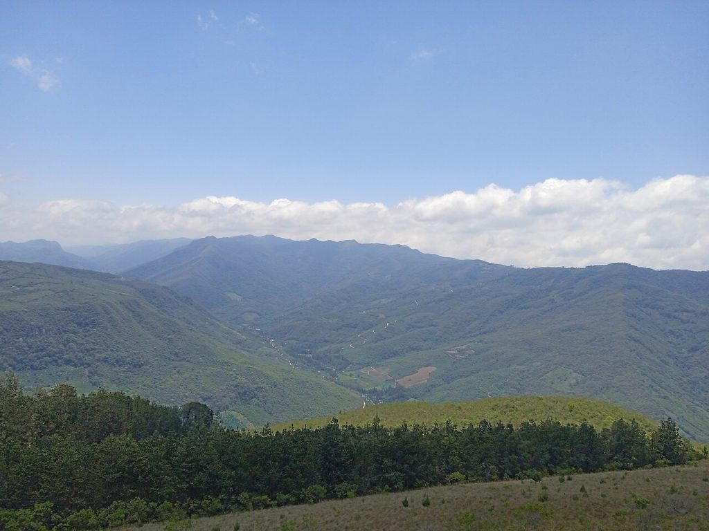 Forested mountains of the Andean foothills under a cloudy sky