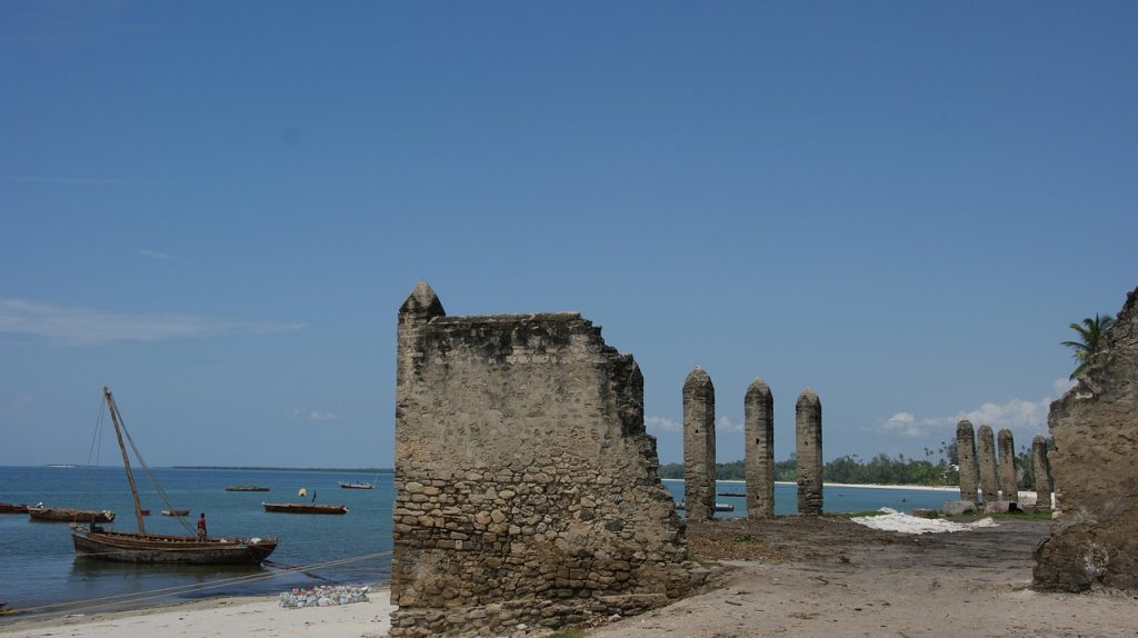 Wooden dhow boats resting on the beach in Bagamoyo