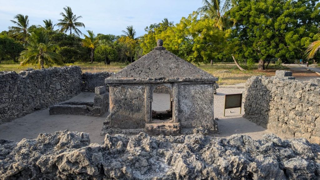 Historic stone ruins in Bagamoyo, Tanzania surrounded by green trees