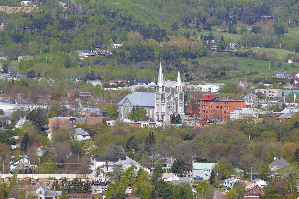 Baie-Saint-Paul Quebec with its twin-spired church among green hills