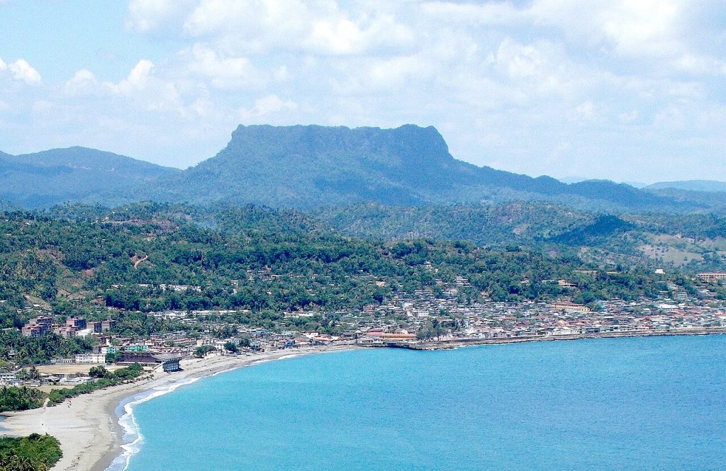 Baracoa Cuba on the coast with the flat-topped El Yunque mountain behind