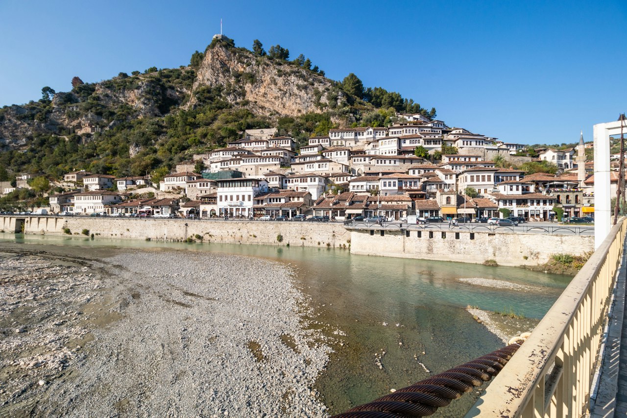 Osum River flowing between two old quarters