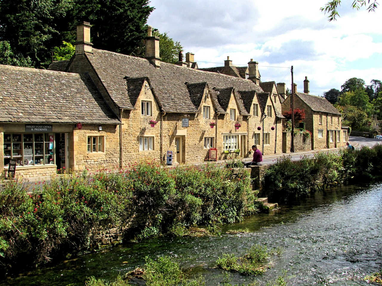 Stone houses beside a calm river