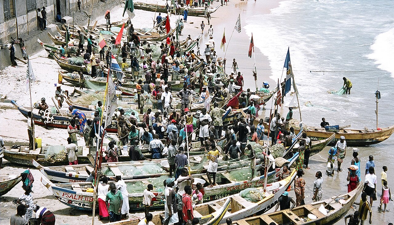 Colorful wooden fishing canoes on the beach in Cape Coast Ghana