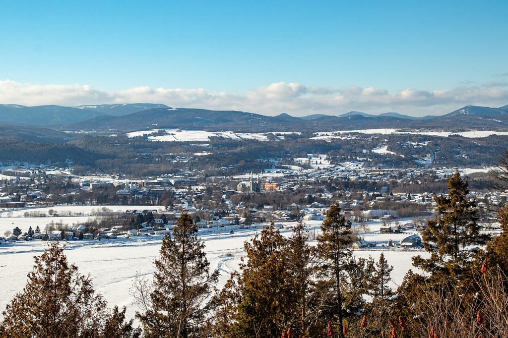 Snowy hills and town rooftops in winter
