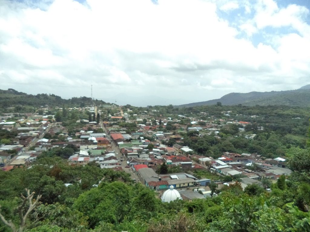Concepción de Ataco seen from the Mirador de la Cruz with green hills behind