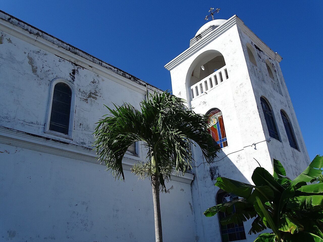 White church with twin towers on a hill
