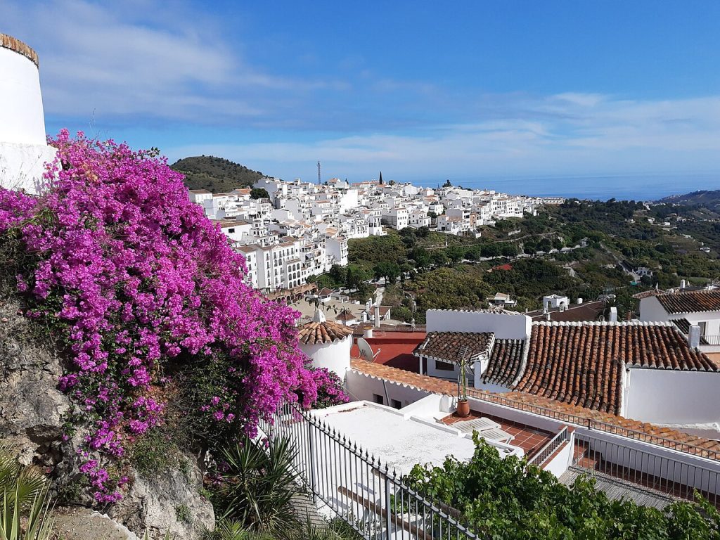 Frigiliana Spain white houses with pink bougainvillea and mountain views