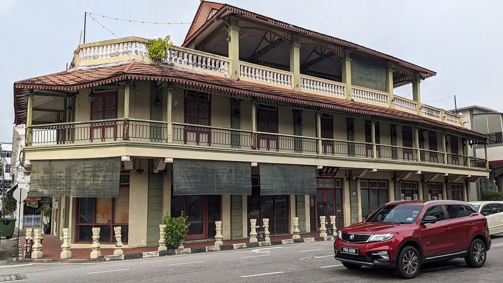 A colonial-era heritage building on a street corner in George Town Penang