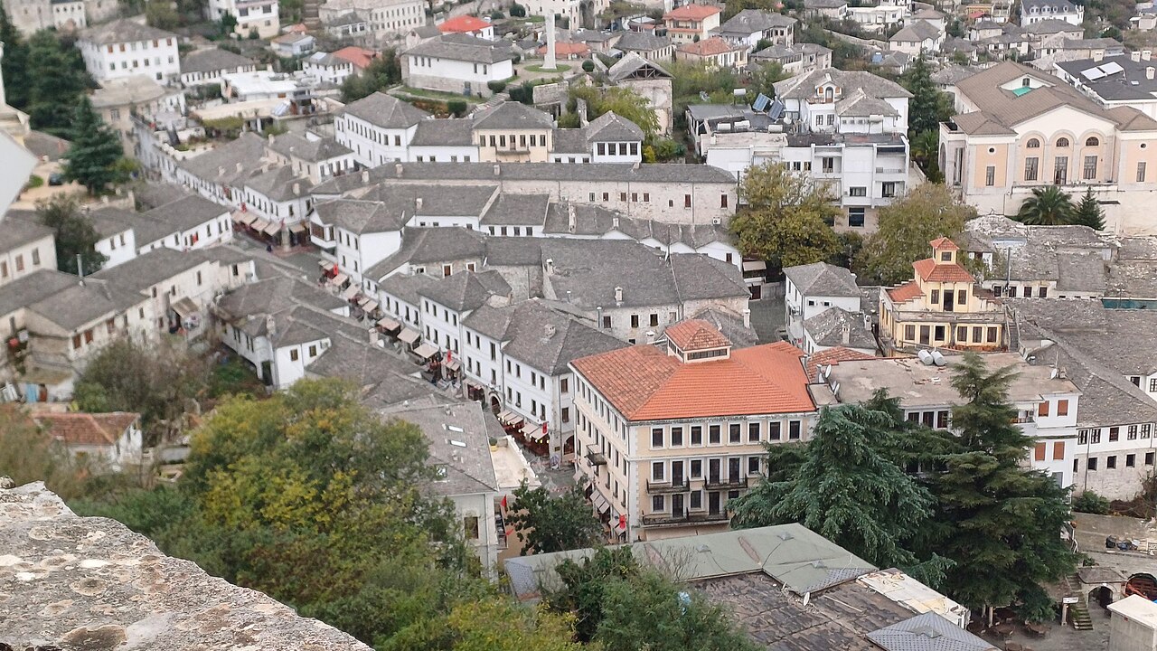 Stone-roofed houses and the old bazaar of Gjirokaster Albania seen from the castle