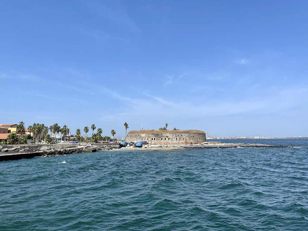 Round stone fort on the shore seen from the arriving ferry